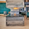 clubroom with a fireplace and chairs