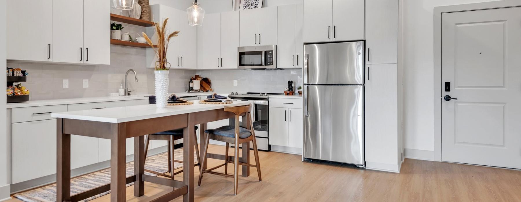 open concept kitchen with white cabinets