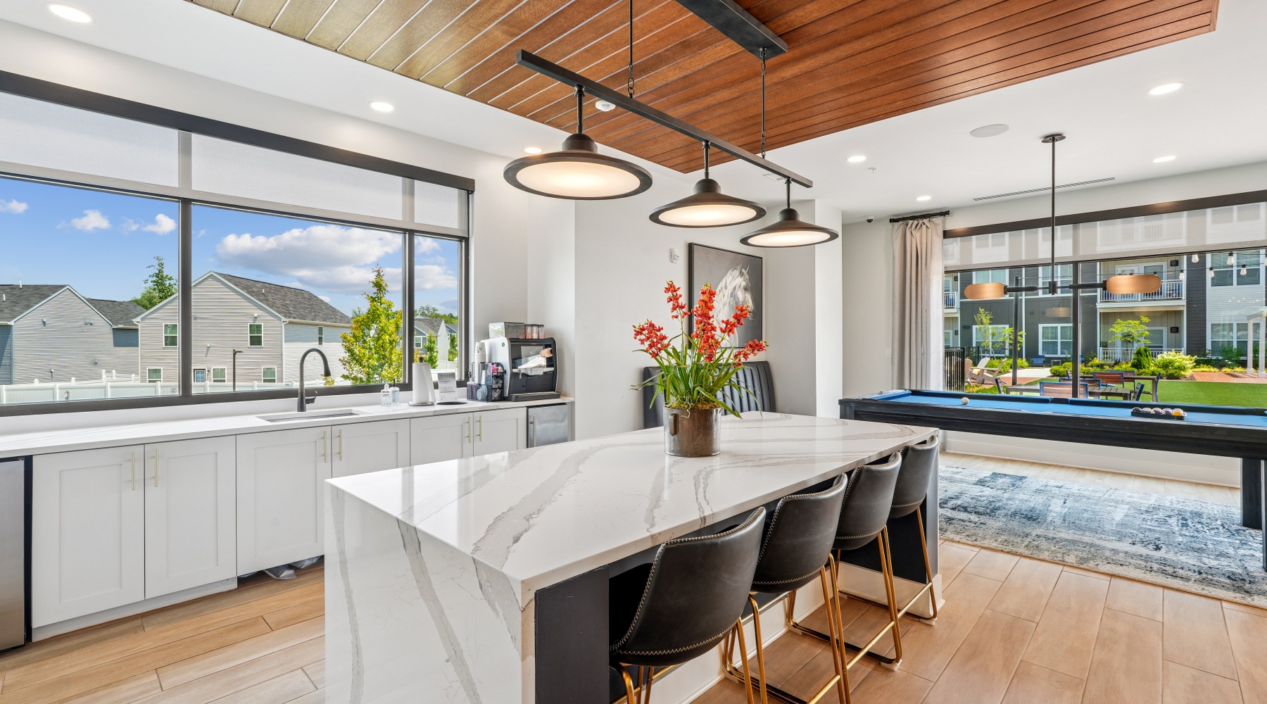 clubroom with coffee bar, pool table, and lounge seating