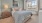 carpeted bedroom with large window