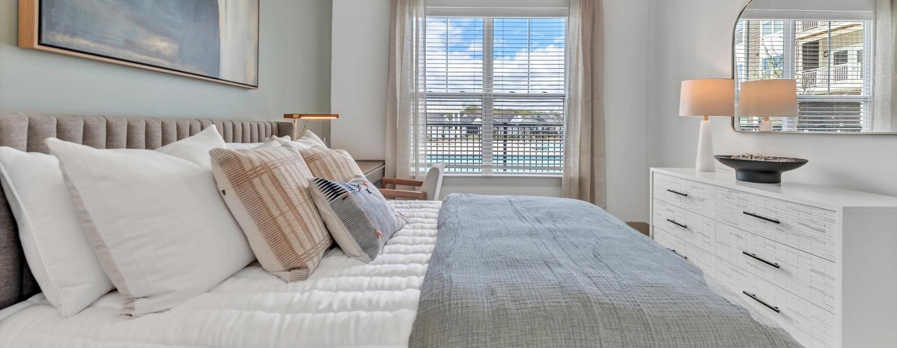window with pool views in bedroom