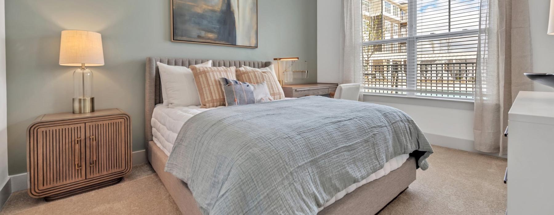 carpeted bedroom with large window